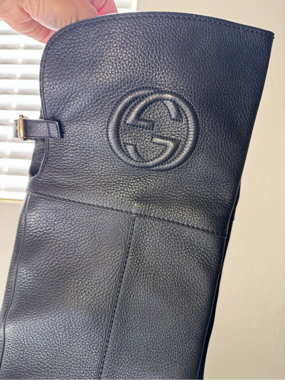 Gucci Black Pebbled Leather women’s over the knee boot with Embossed Gucci Logo